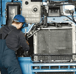 A mechanic repairing a vehicle